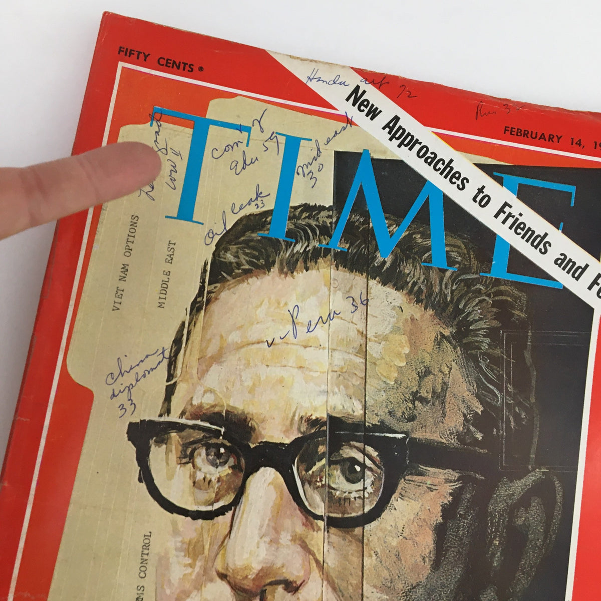 Zoomed in view of the Time Magazine cover from February 14, 1969, showcasing Presidential Adviser Henry Kissinger with visible handwritten notes and cosmetic wear.