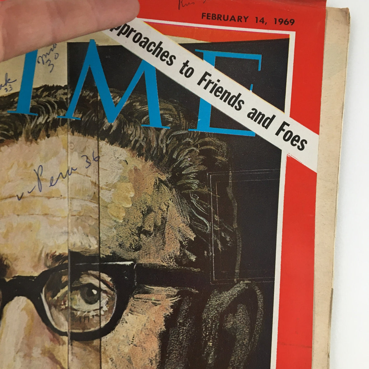 Detailed close-up of the Time Magazine cover dated February 14, 1969, featuring Presidential Adviser Henry Kissinger, highlighting handwritten annotations and the magazine's vintage appeal.