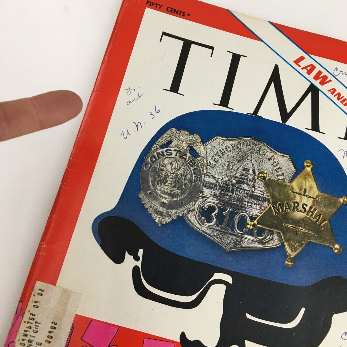 Close-up of the Time Magazine October 4 1968 Vol. 92 No. 14 cover showing police badges and a blue police hat, emphasizing the theme 'Law and Order' amid a vibrant background.