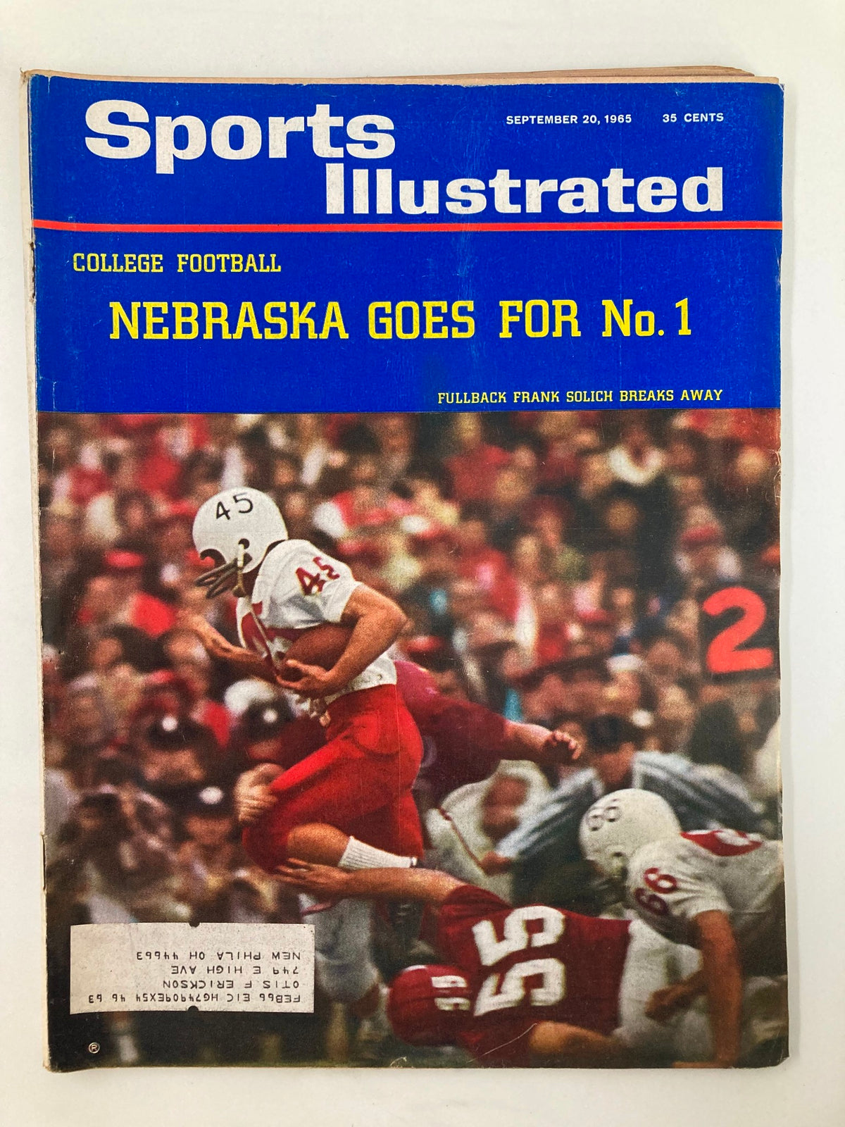 Sports Illustrated magazine cover from September 20, 1965, featuring Fullback Frank Solich with the title 'Nebraska Goes for No. 1'. This vintage sports magazine highlights the excitement of college football and captures a significant moment in sports history.