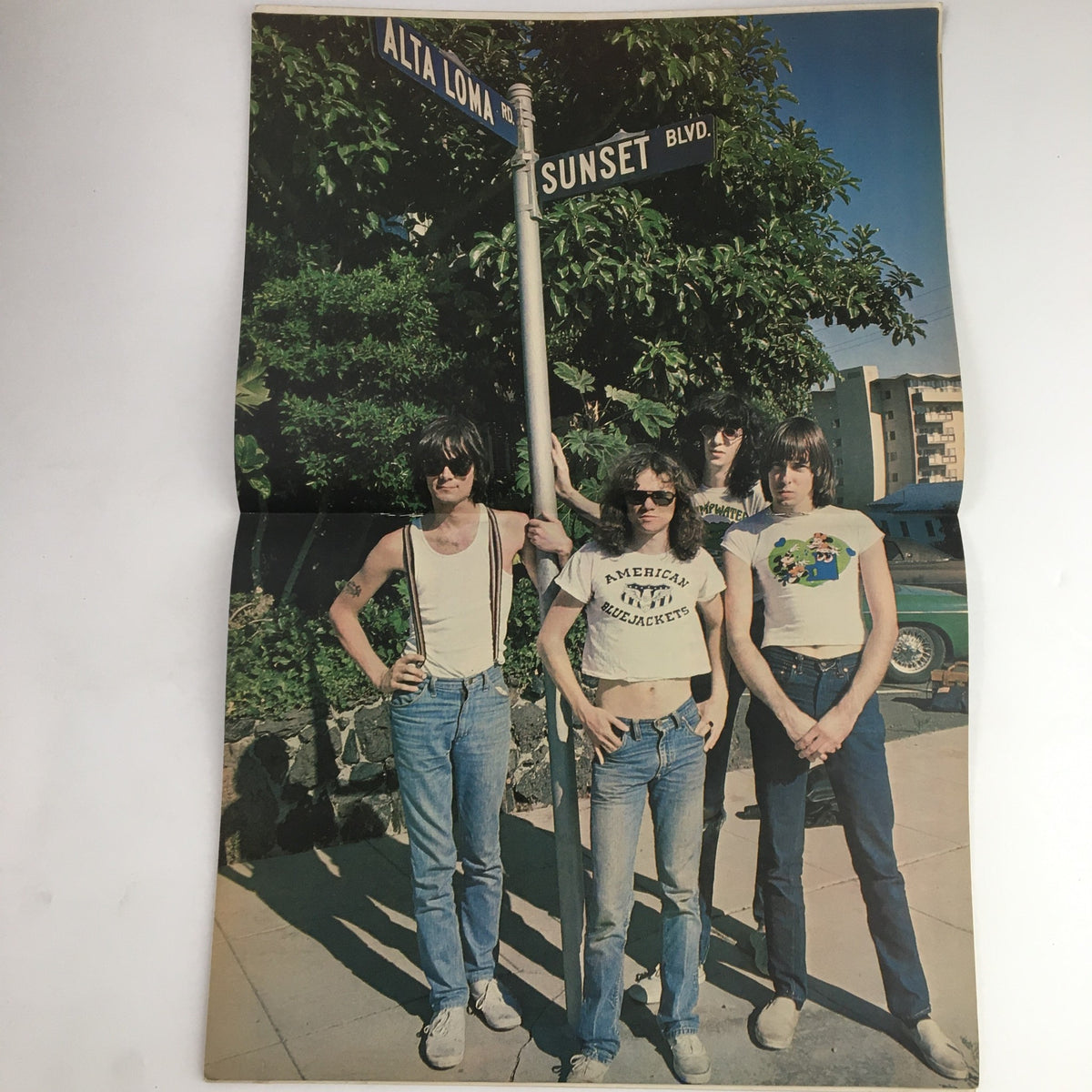 A vibrant poster from Hit Parader Magazine March 1978 featuring the Ramones standing at the intersection of Alta Loma and Sunset Blvd, capturing the essence of 1970s rock culture.