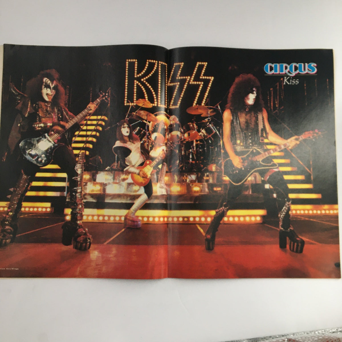 Circus Magazine February 2 1978 double-page spread of Kiss, illustrating the band's legendary performance style and stage presence.