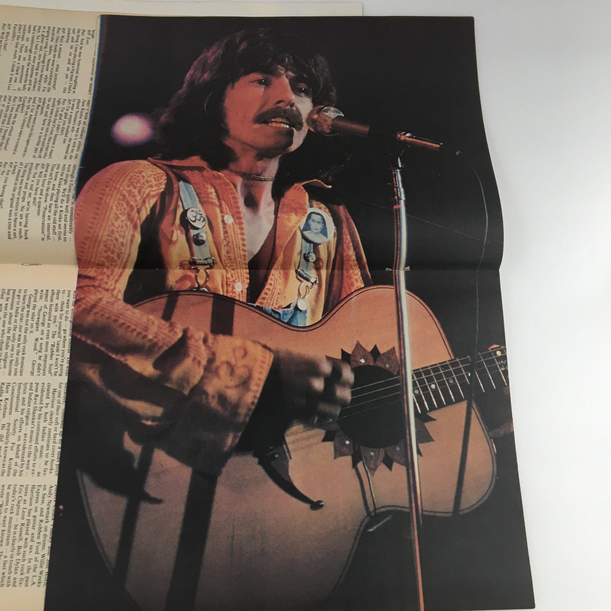 Detachable poster from Hit Parader Magazine April 1975 featuring a vintage performance shot of George Harrison, enhancing the collectible appeal of this music magazine.