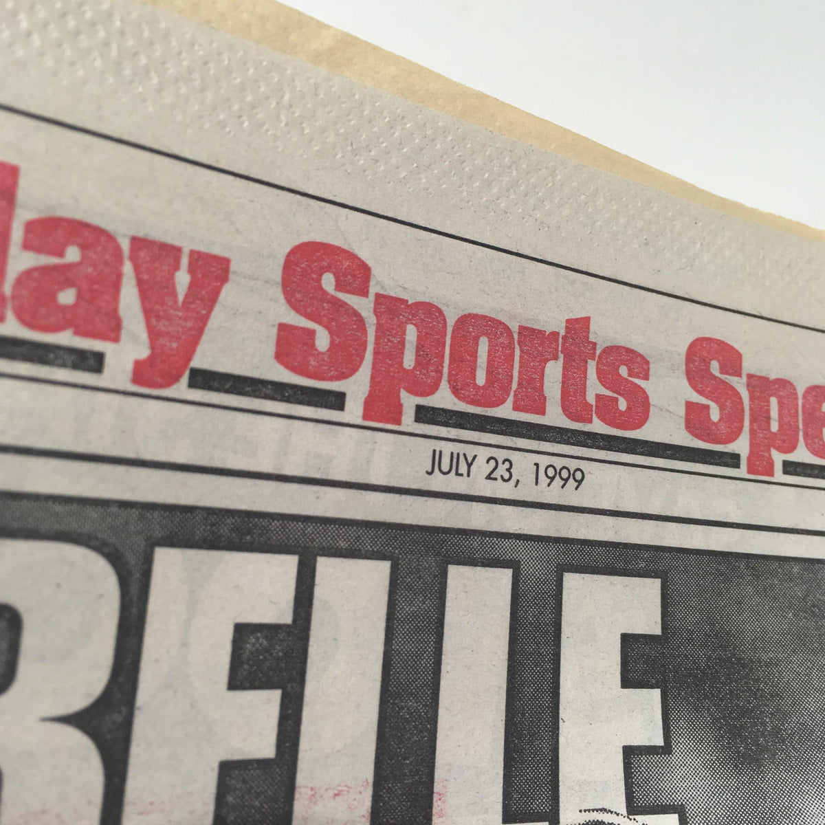 Close-up of the NY Post sports section header dated July 23, 1999, emphasizing the sports news features.