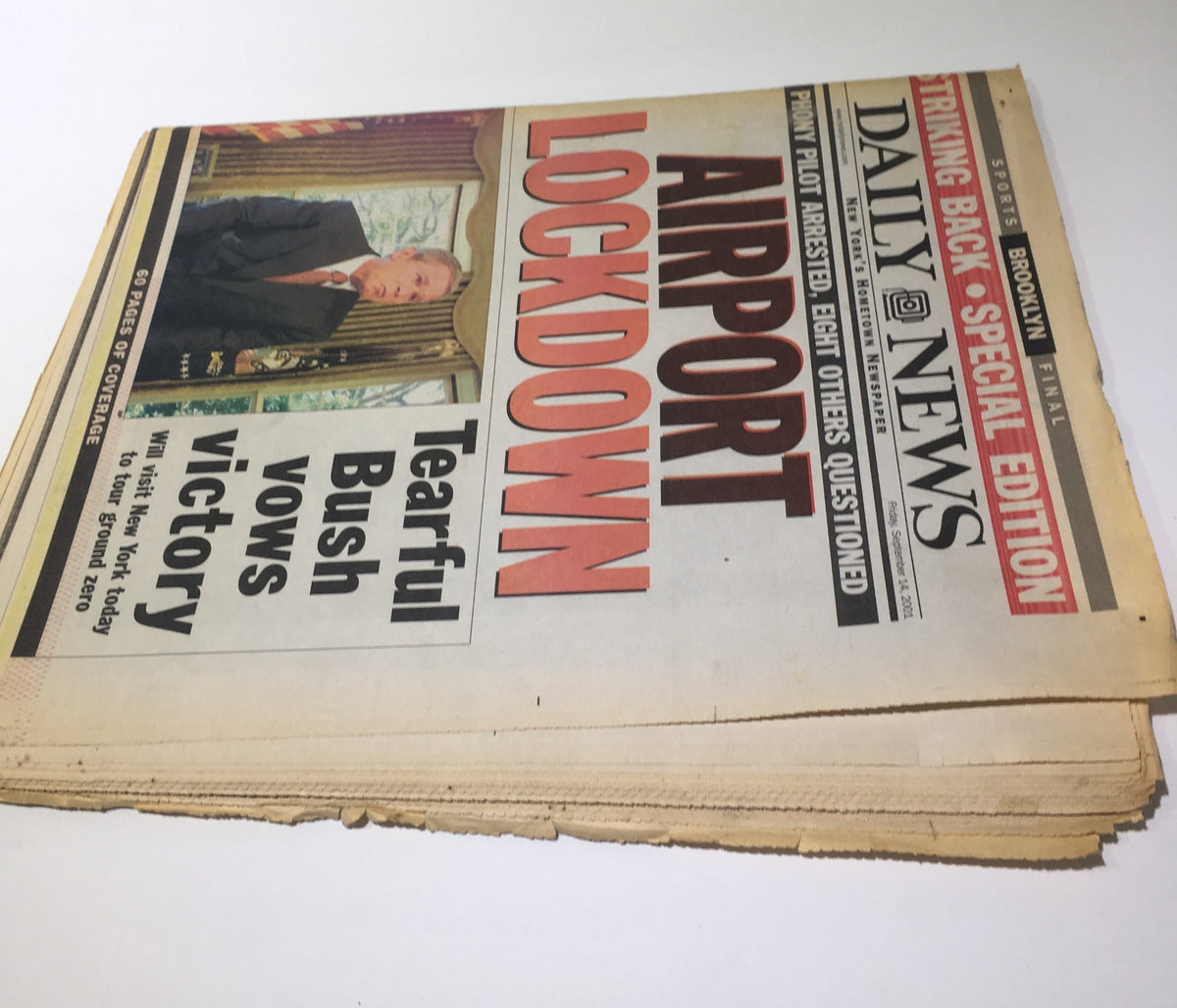 NY Daily News front page snapshot highlighting the 'Airport Lockdown' news with a tearful President Bush, published on September 14, 2001, capturing the nation's response after the attacks.