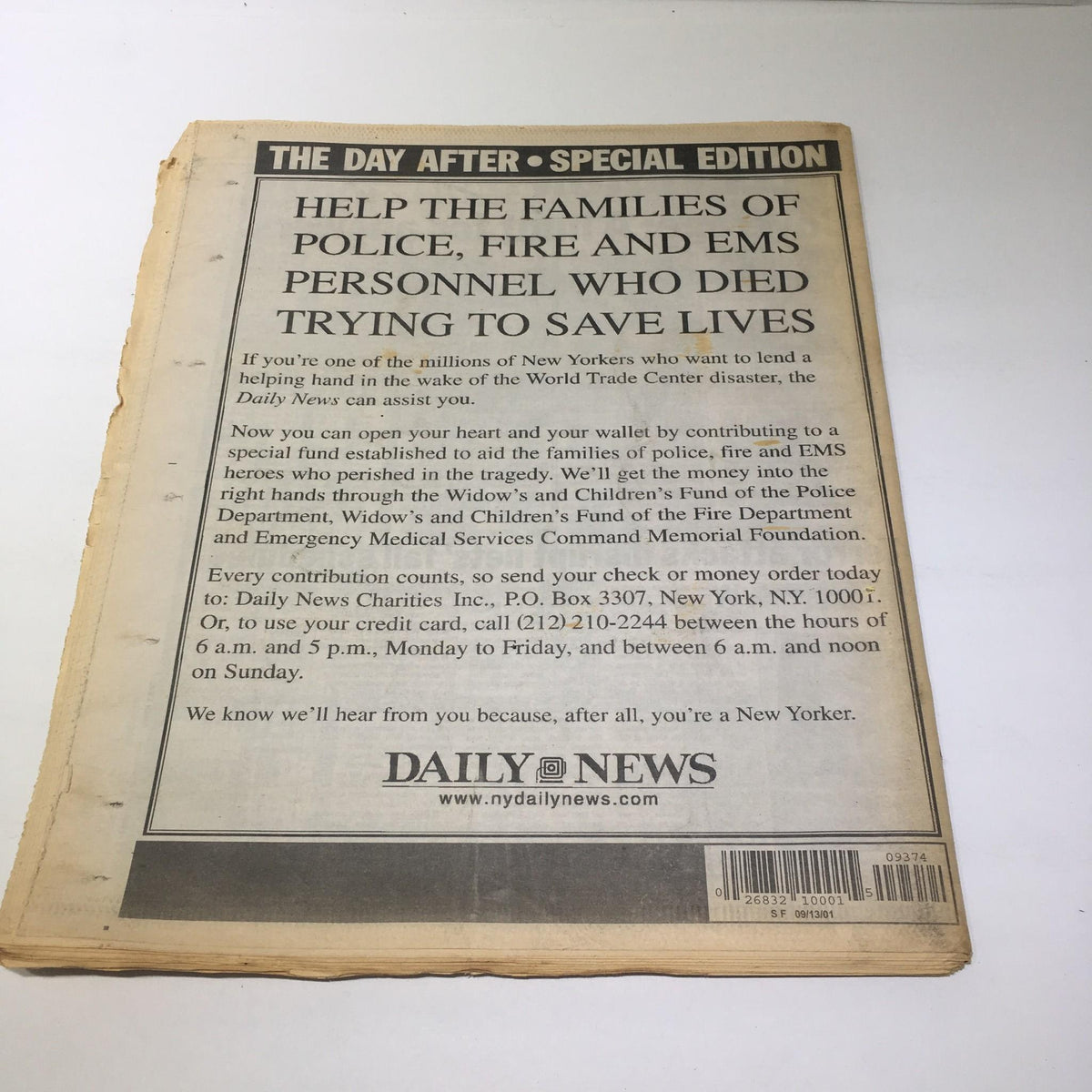 Back cover of the NY Daily News special edition, urging donations to help families of police and EMS personnel affected by the September 11 attacks.
