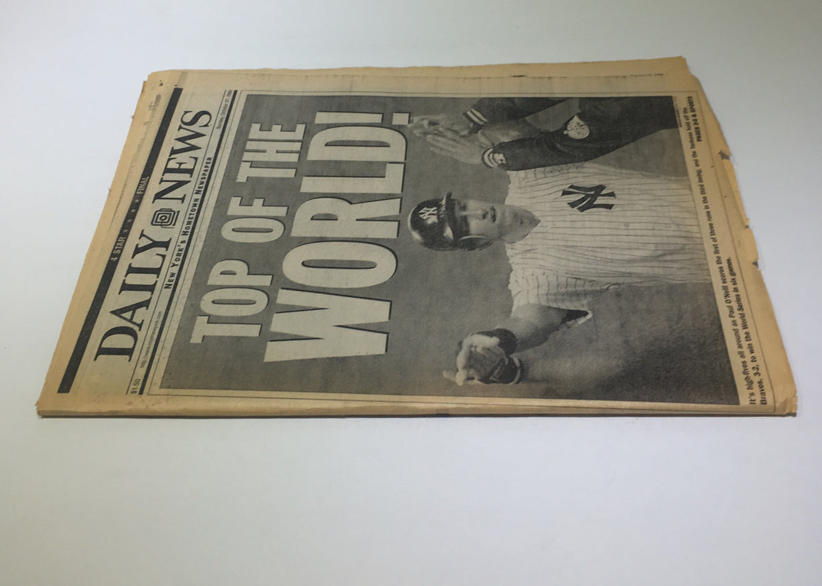 New York Daily News showing Yankees celebratory headline 'Top Of The World' on the front page, commemorating the 1996 World Series win.