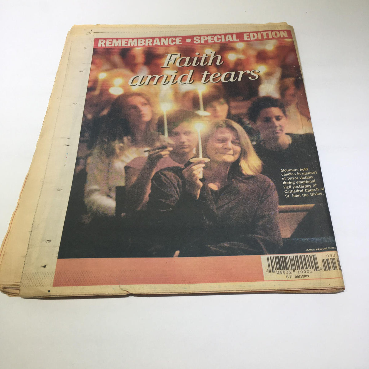 New York Daily 911 President George W Bush Rememberence Special edition. Cover photo showing mourners holding candles with the title 'Faith amid tears,' capturing a moment of reflection after the tragedies.