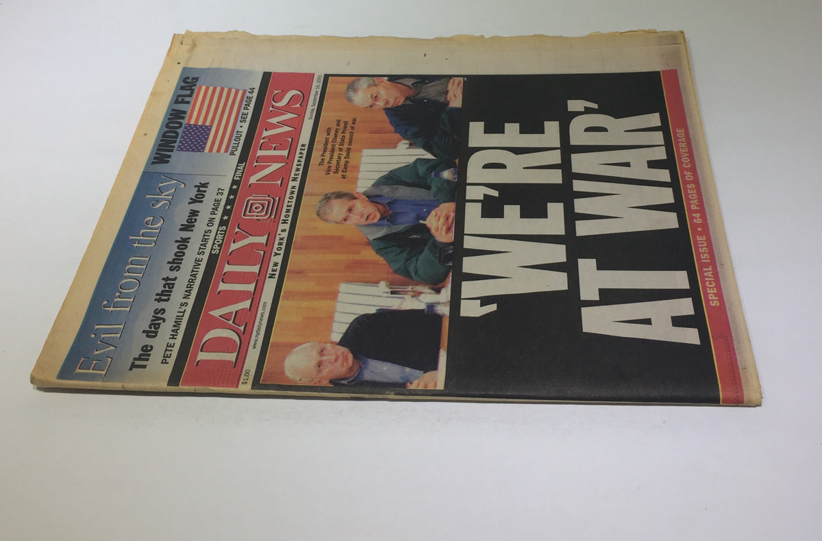 New York Daily News cover from September 16, 2001, featuring the headline 'WE'RE AT WAR', depicting leaders in a discussion, marking a significant historical moment.