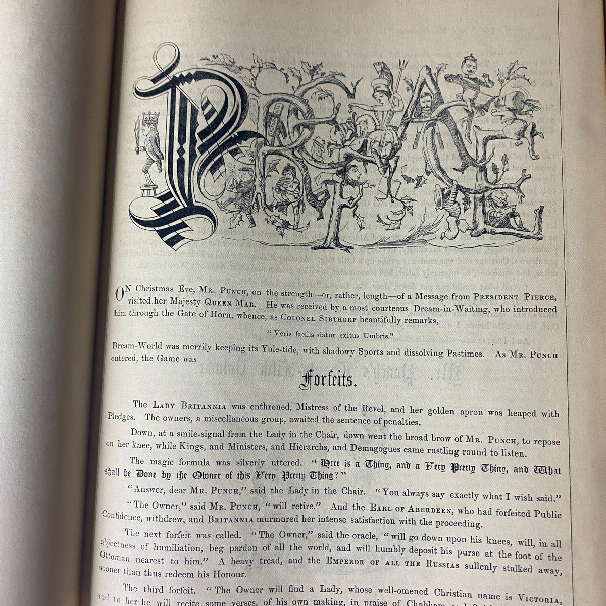 Interior page from Punch Magazine Volume XXV from 1853, showcasing ornate typography and humorous illustrations focused on social commentary of the era.