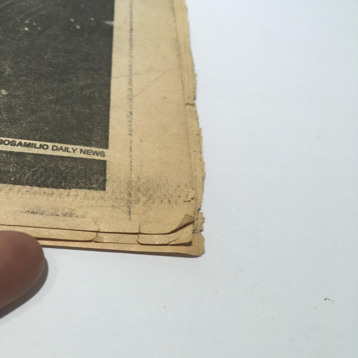 Side view of the July 4, 1986 Ny Daily News illustrating slight damage to the edges, emphasizing its vintage condition.
