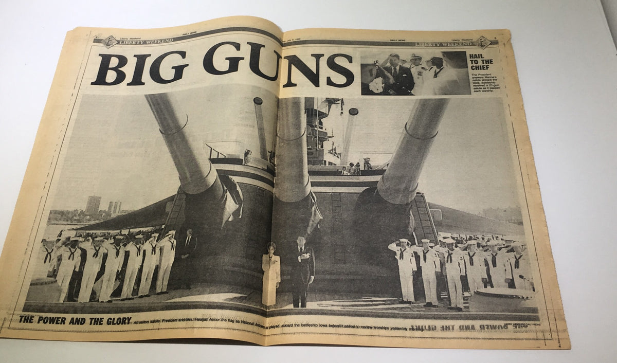 Inside spread of the New York Daily News from July 5, 1986, with the headline 'BIG GUNS' showcasing a historical image of naval forces and a presidential figure.
