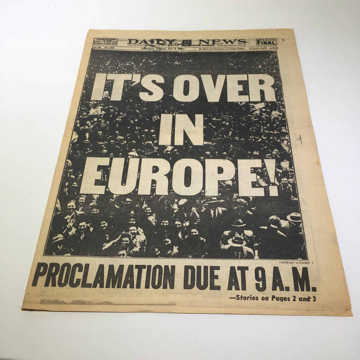 Front page of the New York Daily News, May 8, 1945, featuring the bold headline 'IT'S OVER IN EUROPE!'. The proclamation is due at 9 A.M. with crowd images celebrating victory.