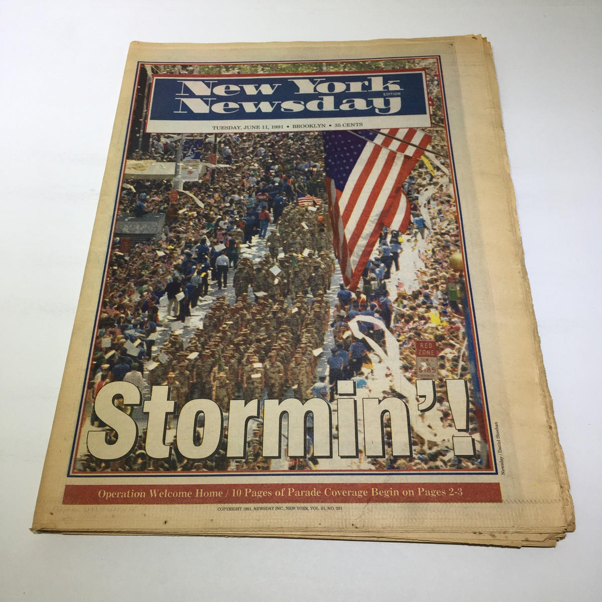 Front cover of NY Newsday from June 11, 1991, featuring a parade scene with an American flag and the headline 'Stormin'!' highlighting a significant event.