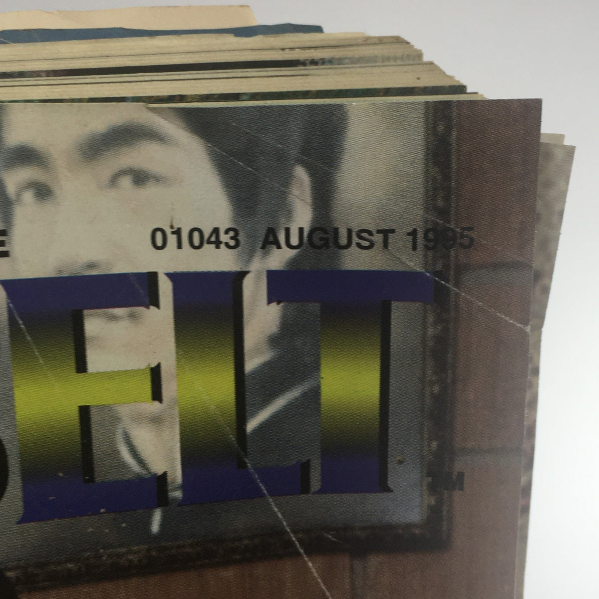 Another view of the pages of Black Belt Magazine August 1995, showing the magazine's age through frayed edges and well-loved appearance.