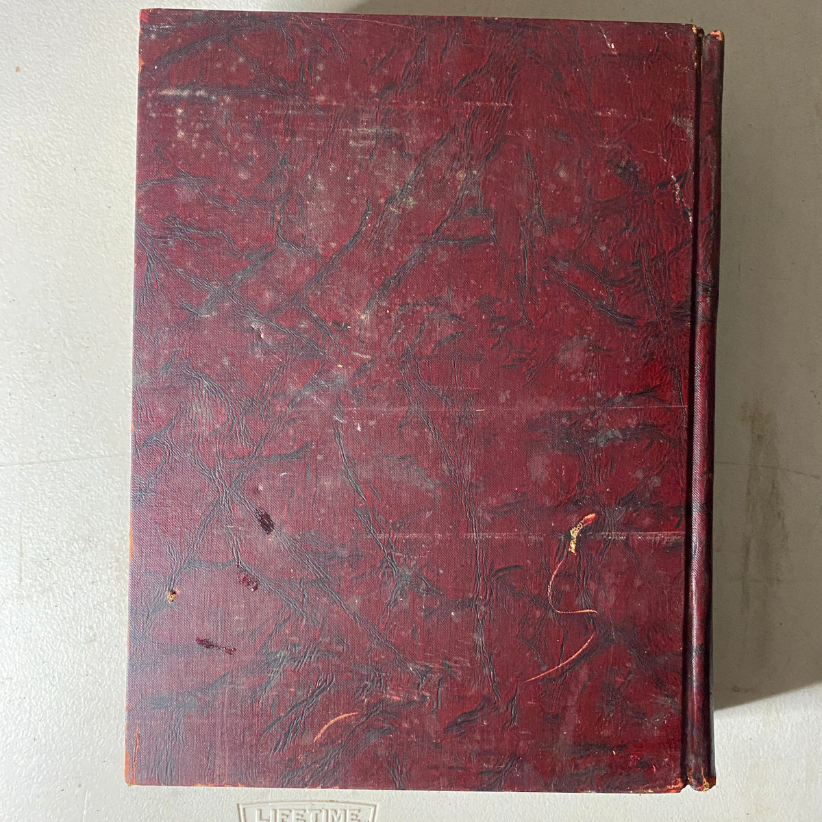 Top view of the red bound hardcover of VTG 1937 Bound Life Magazine, showcasing its textured surface and overall vintage appearance.