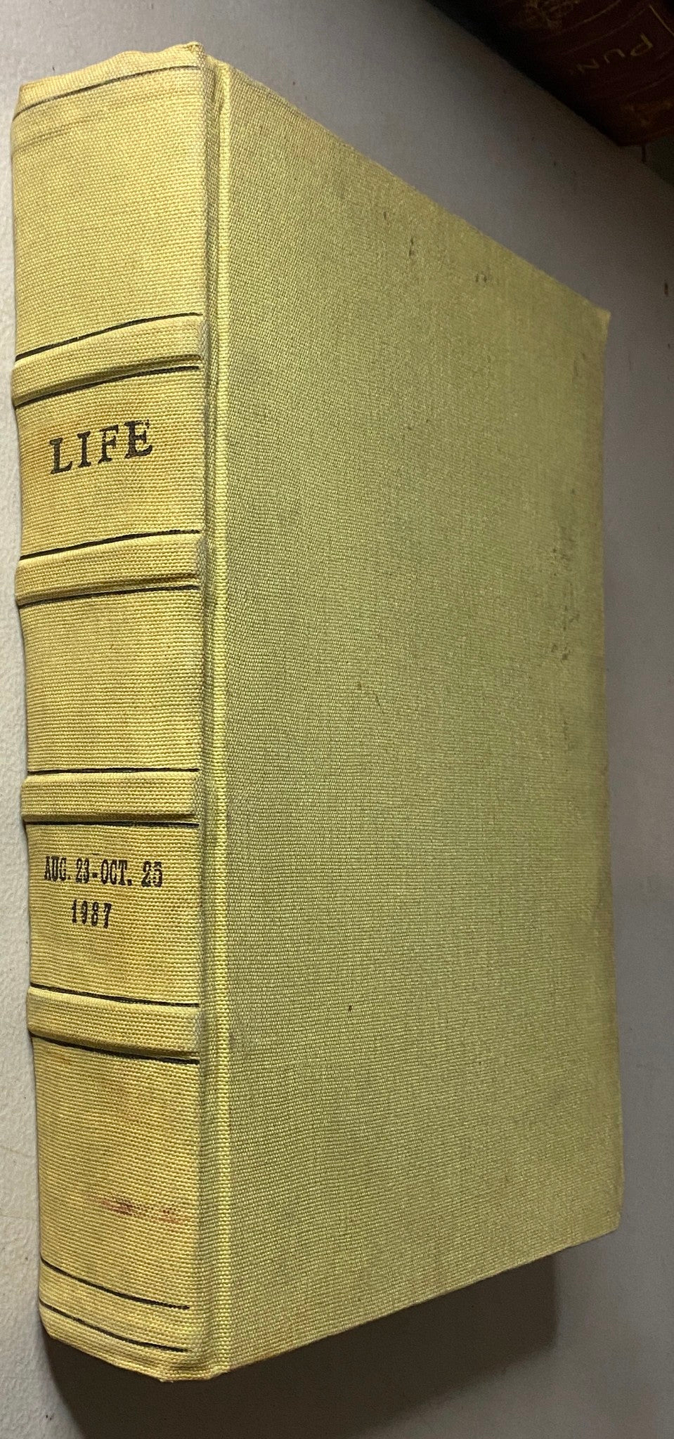 Side view of VTG 1937 Bound Life Magazine with embossed title 'LIFE' and date range August 23 - October 25, 1937.