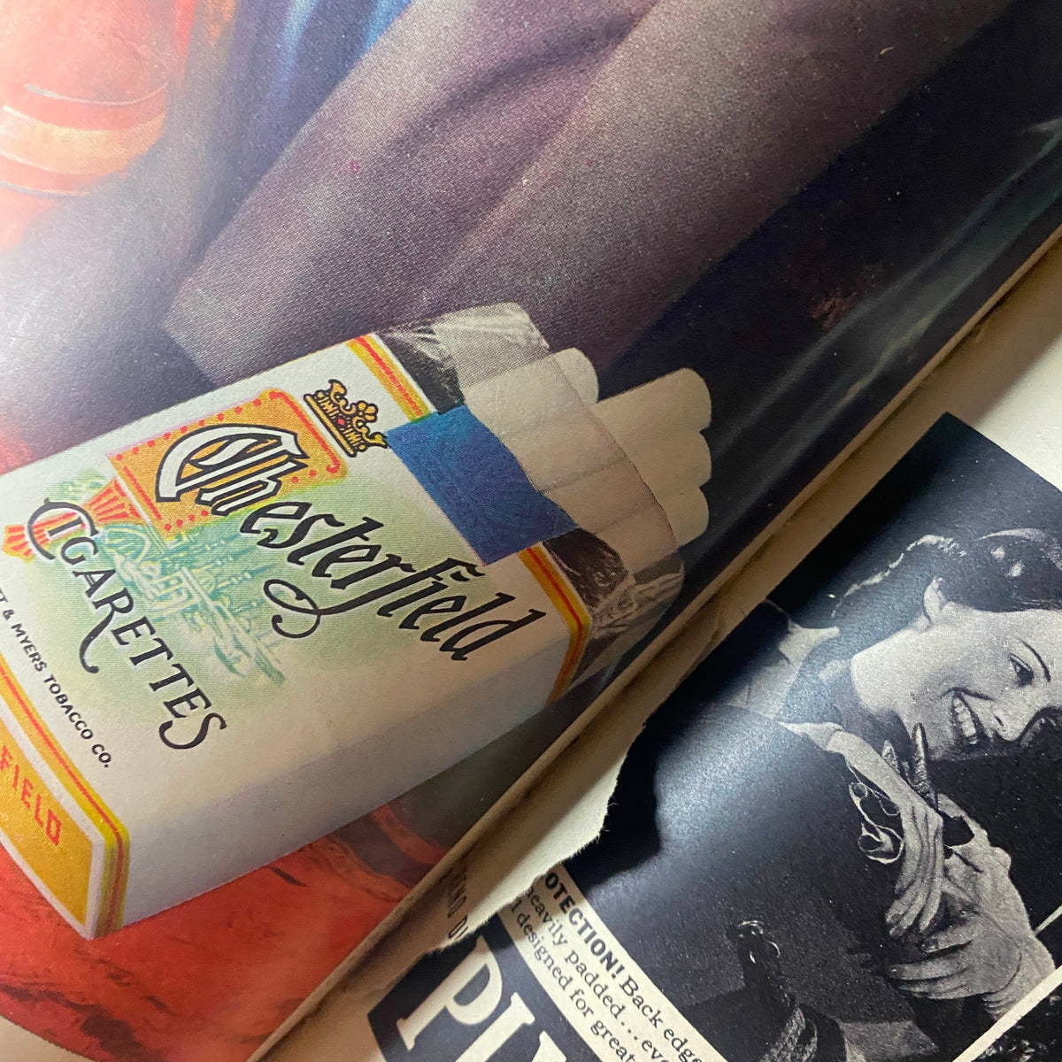 Close-up of a vintage Plymouth car advertisement in the VTG 1937 Bound Life Magazine, featuring Chesterfield cigarettes and 1930s lifestyle elements.