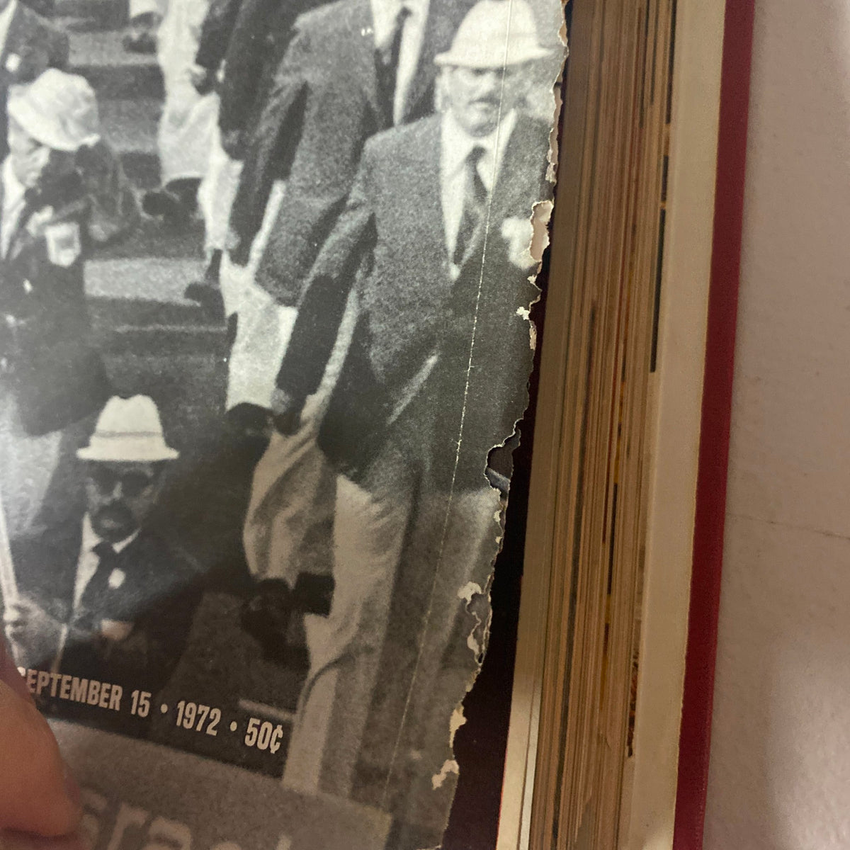 Detail of VTG 1972 Bound Life Magazine showing damage to the page covering the Olympic Tragedy, emphasizing the historical importance of the event.