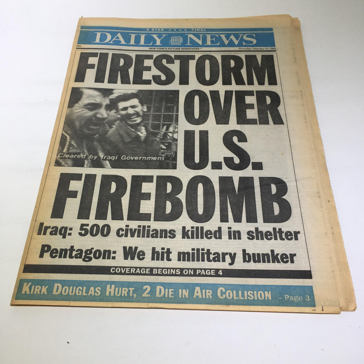New York Daily News front page from February 14, 1991, featuring the headline 'FIRESTORM OVER U.S. FIREBOMB' discussing Iraq's casualty reports and U.S. military actions.