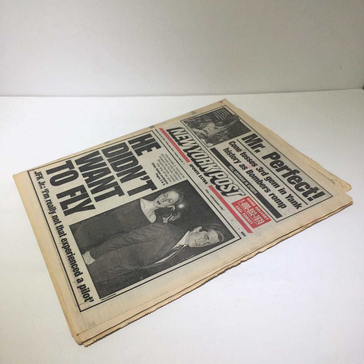 New York Post cover with the headline 'He Didn't Want to Fly' featuring a photo of JFK Jr. and Carolyn Bessette Kennedy, emphasizing the story surrounding their tragic flight.