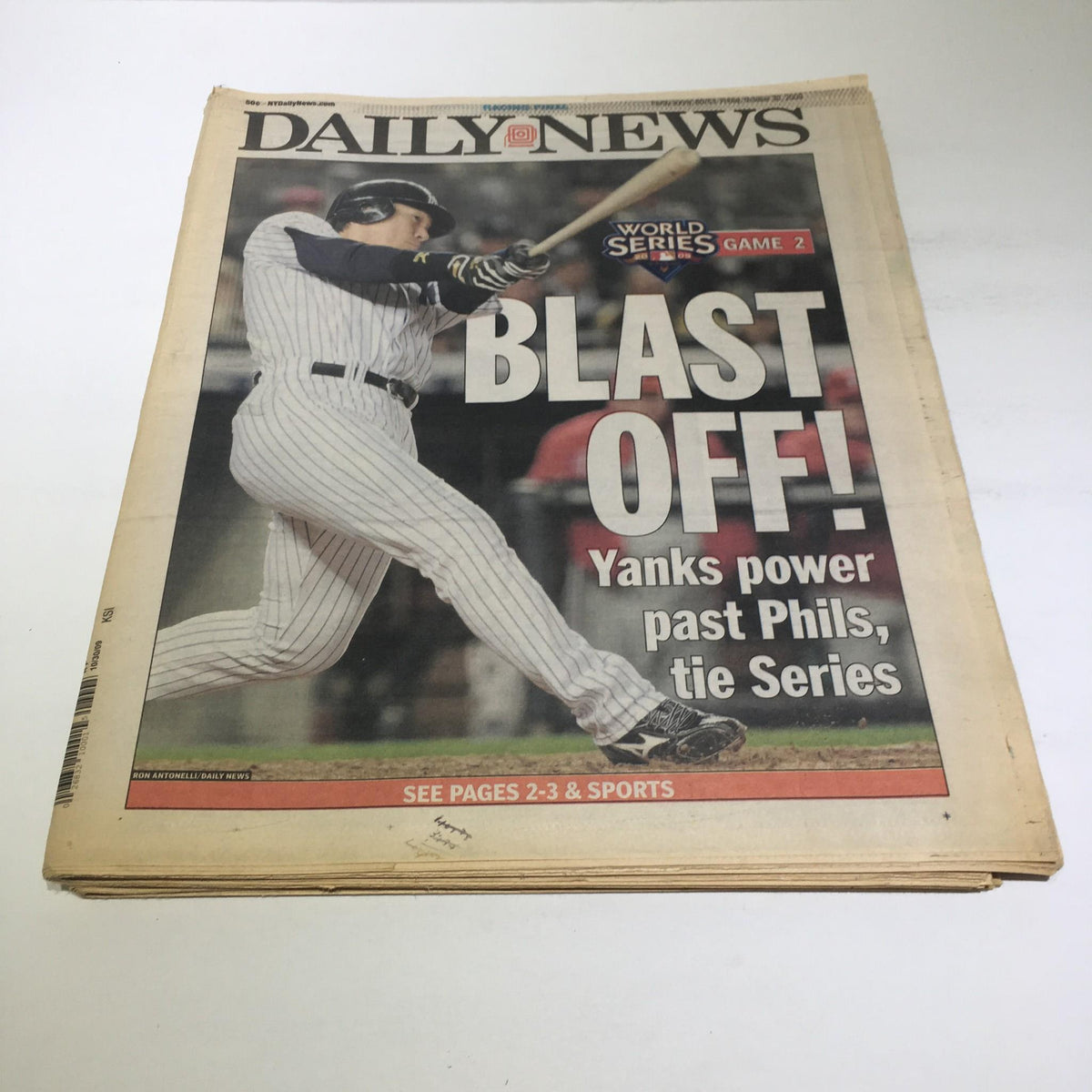 NY Daily News cover from October 30, 2009, featuring the headline 'Blast Off! Yanks power past Phils, tie Series', showcasing a New York Yankees player in action.