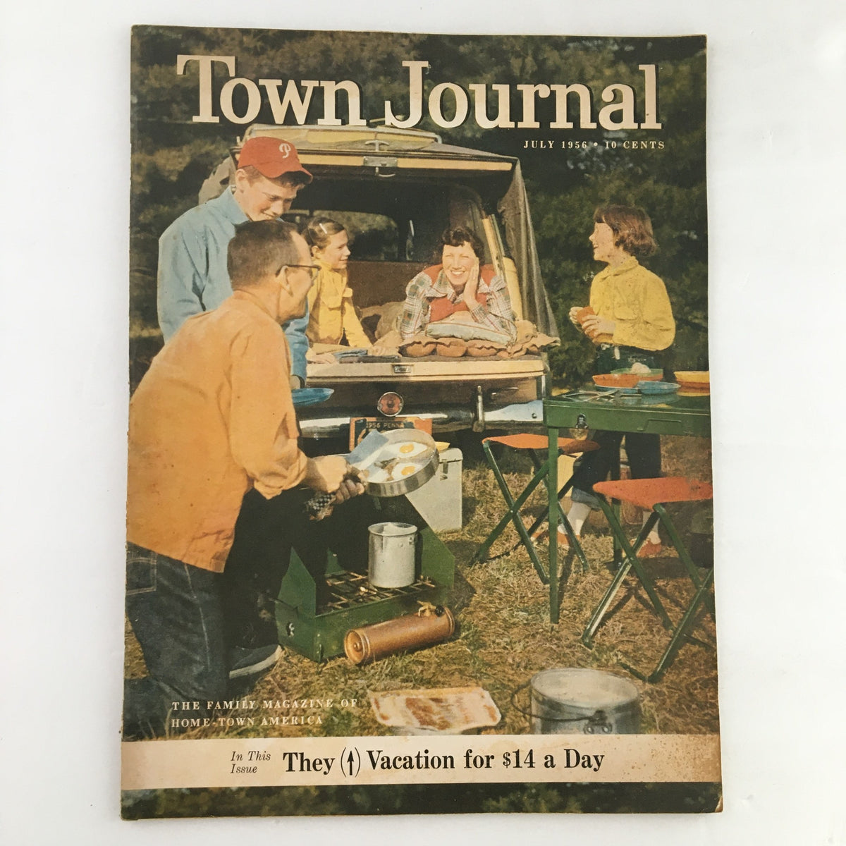Cover of Town Journal Magazine July 1956 featuring the Mertz Family on vacation with a picnic setup, showcasing mid-century family travel charm.