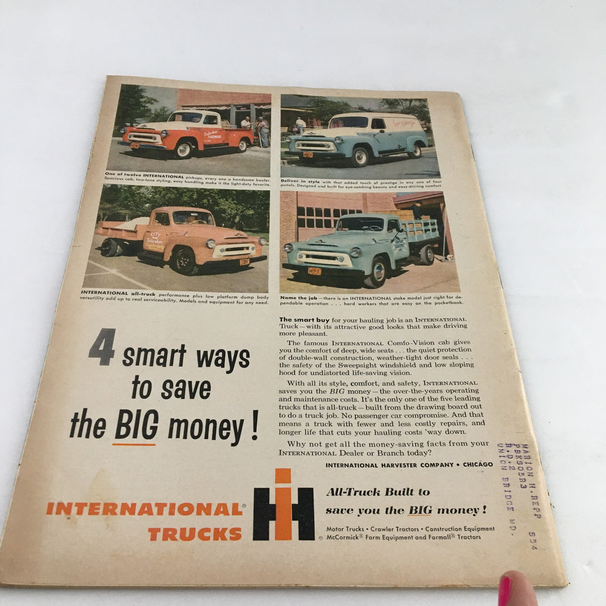 Back cover of Town Journal Magazine July 1956 featuring a vintage advertisement for International Trucks, showcasing different truck models and highlighting savings on vehicle purchases.