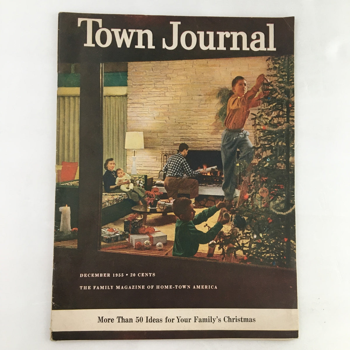 Cover of Town Journal Magazine, December 1955, showcasing a festive family scene with children decorating a Christmas tree.