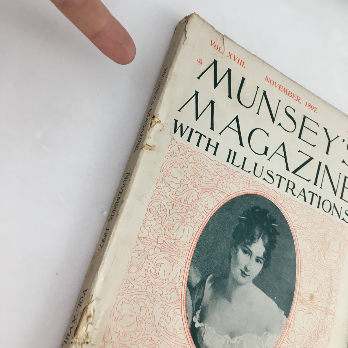 Close-up of the spine of Munsey's Magazine November 1897, Vol. 18 No. 2, highlighting its wear and age, providing insight into the magazine's vintage condition.