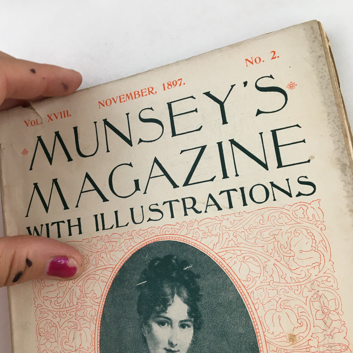 Another view of the cover of Munsey's Magazine November 1897, Vol. 18 No. 2 showing the title prominently with a woman's portrait, emphasizing the publication's artistic focus.