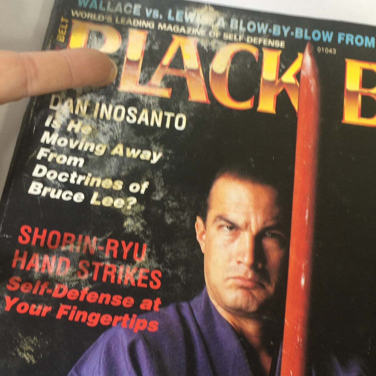 Close-up of the cover of Black Belt Magazine December 1990, highlighting Dan Inosanto and the Shorin-Ryu article, emphasizing martial arts history.