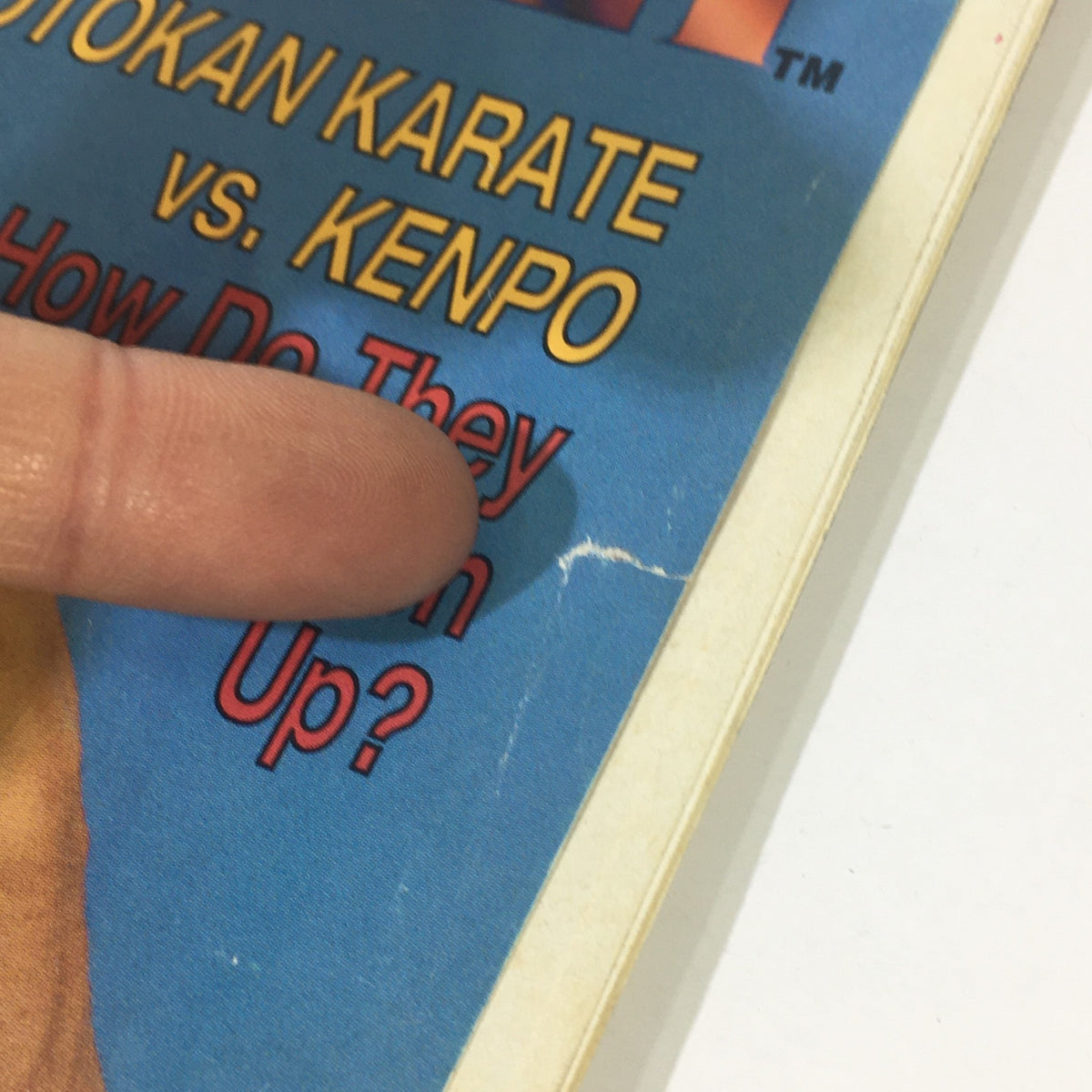 Detail of the front cover of Black Belt Magazine March 1996, focusing on the text about Shotokan Karate vs Kenpo and its matchup analysis.