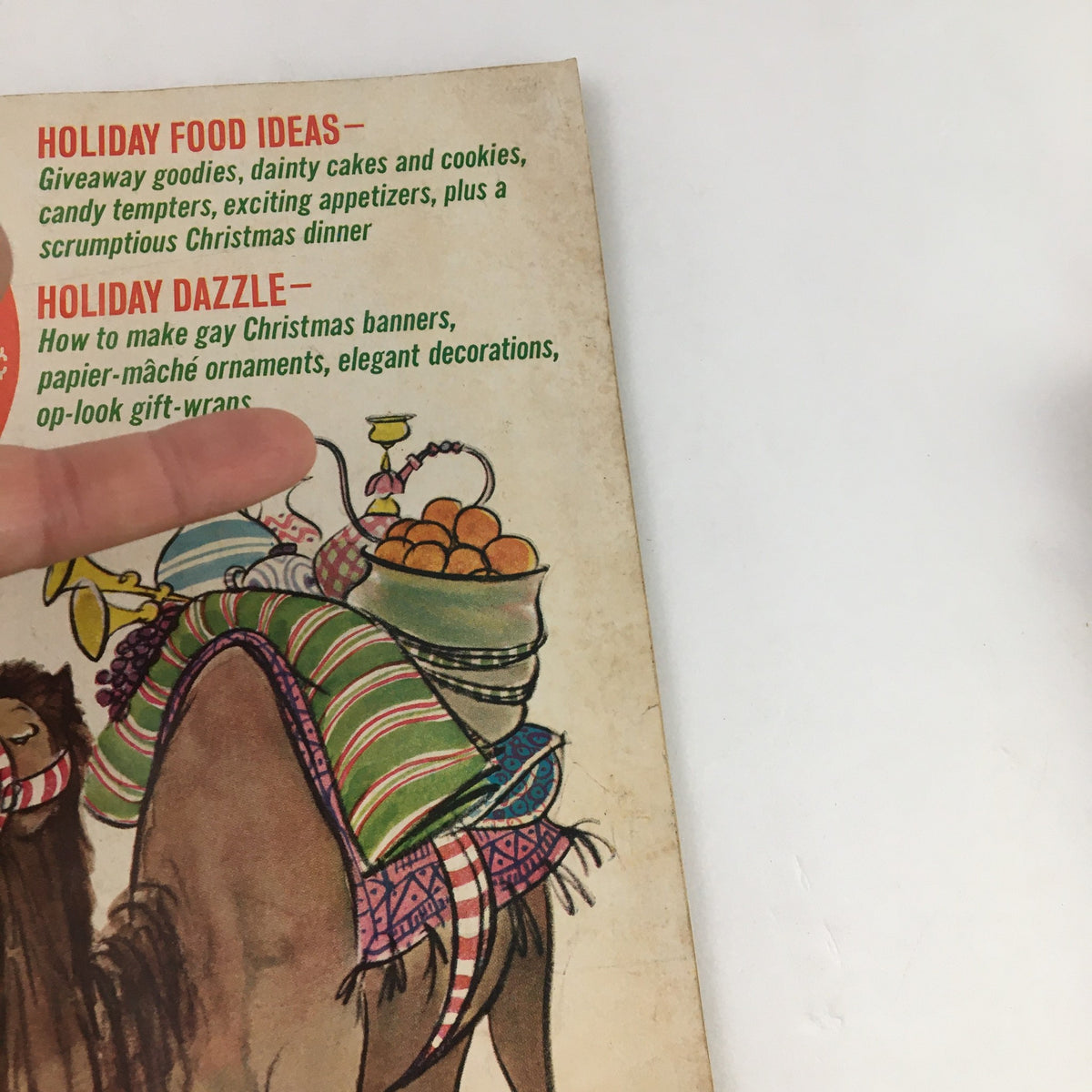 Close-up of the Family Circle Magazine December 1966 showing details about holiday recipes and decorations, highlighting the article by Ogden Nash titled "Childhood is Exposed".