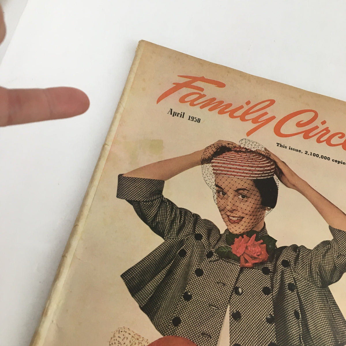 Detailed view of the April 1950 Family Circle Magazine cover, highlighting a woman in a fashionable outfit with a hat, emphasizing the 'Holy Year in Rome & The Great Smokies' theme.
