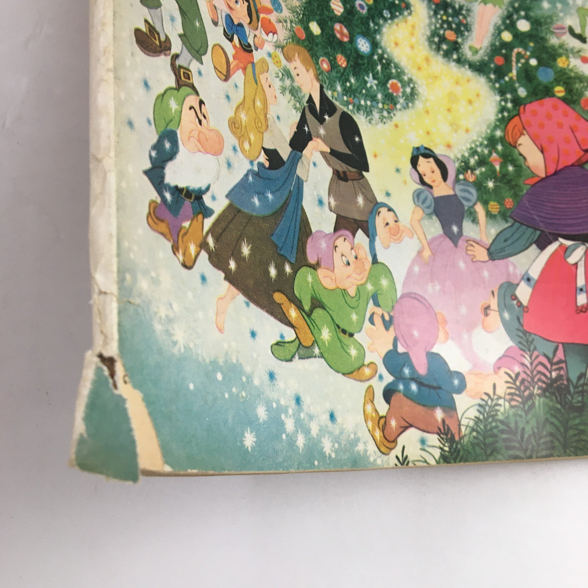 Family Circle Magazine December 1958 cover illustration featuring beloved Disney characters celebrating Christmas at Disneyland, showcasing vibrant colors and nostalgic artwork.
