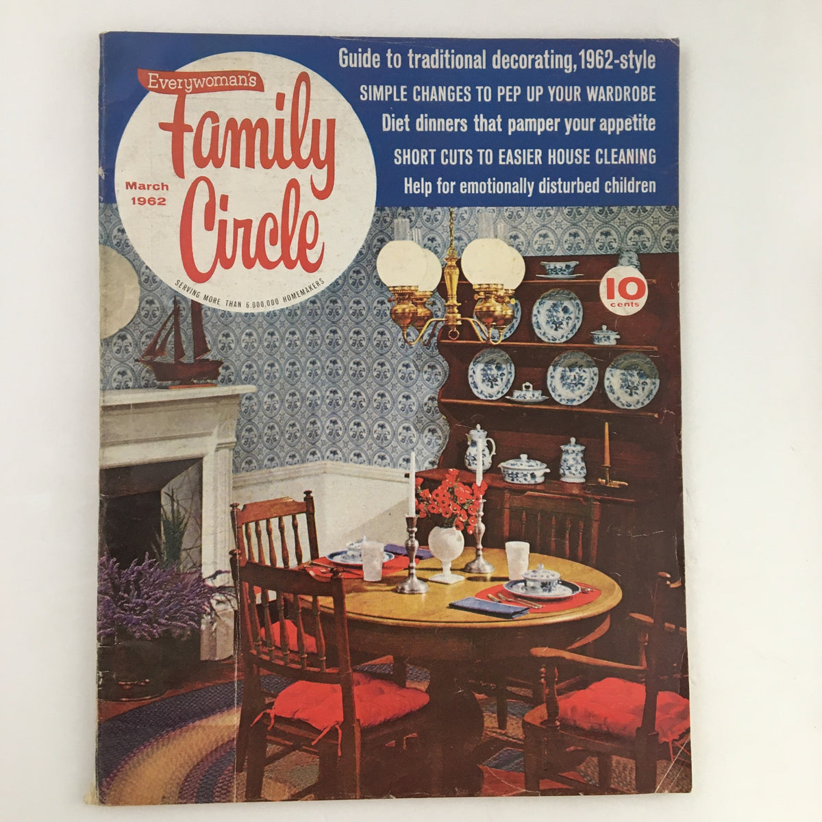 Family Circle Magazine March 1962 cover featuring traditional decorating insights, showcasing a classic dining setup, featuring a round table, wooden chairs, and blue decorative plates against a patterned wallpaper background.