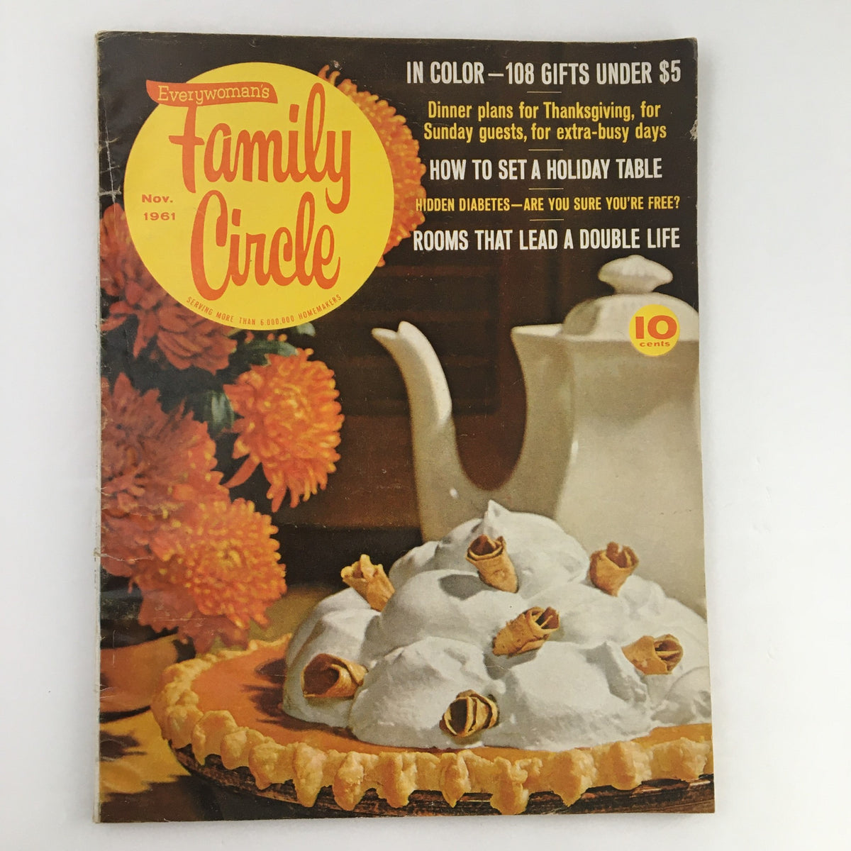 Family Circle Magazine November 1961 cover featuring holiday table setting tips, showcasing a pie with whipped cream, a teapot, and marigold flowers, perfect for vintage magazine collectors.