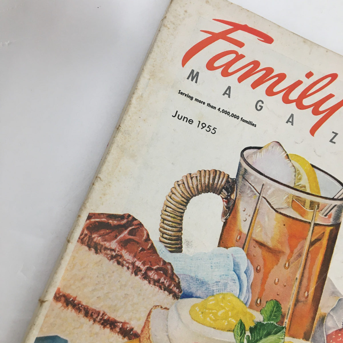 Detailed view of Family Circle Magazine June 1955 cover, focusing on the drink and dessert illustrations, with the title prominently displayed. A unique vintage magazine reflecting mid-20th century cultural themes.