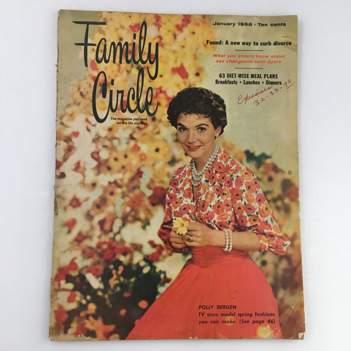 Family Circle Magazine January 1958 cover featuring Polly Bergen modeling spring fashions with a floral background.