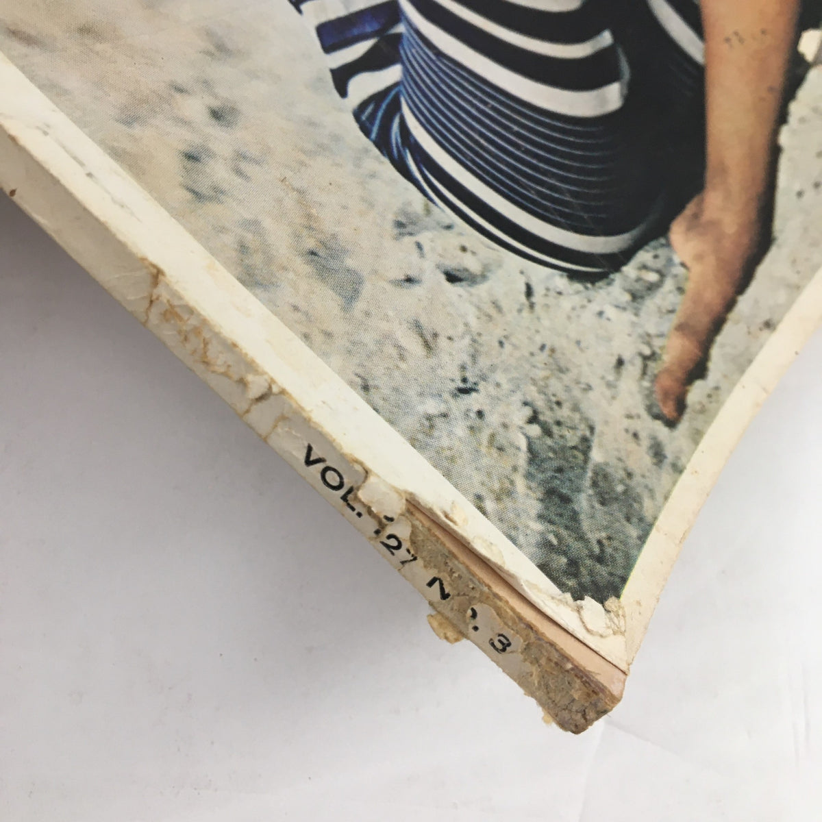 Side view of the Redbook Magazine July 1966 showing wear and tear on the spine, highlighting its vintage condition.