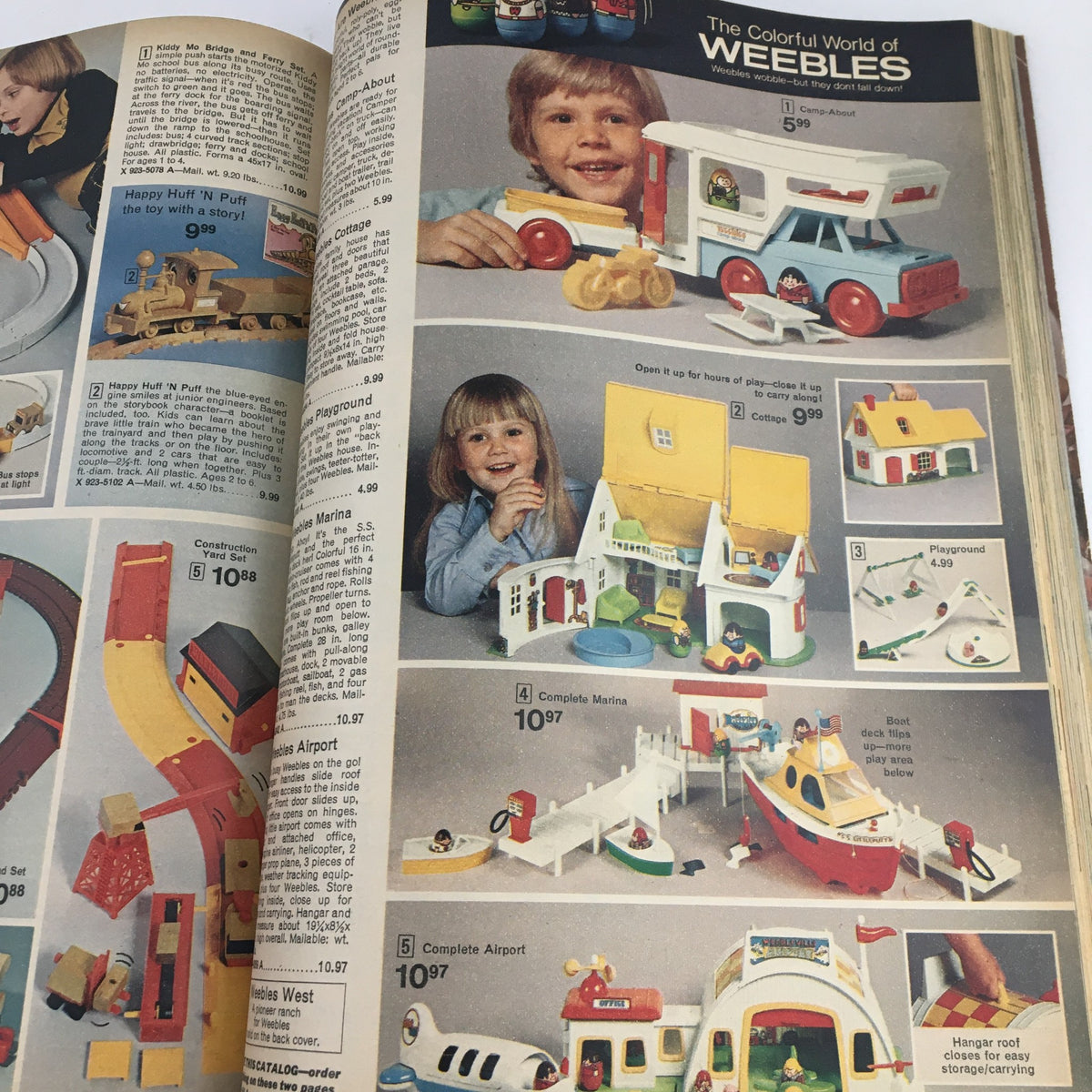 1974 JCPenney Christmas Colorful Weebles Toys and Dresses Price Catalog highlighting the Colorful World of Weebles toys and a child playing with toy vehicles.