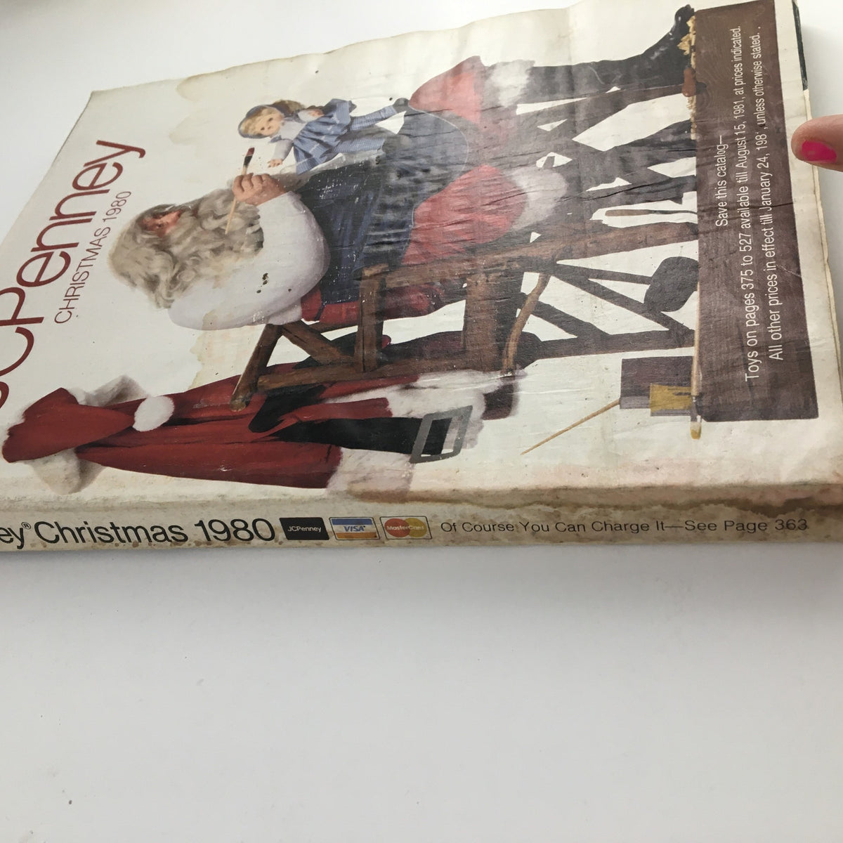 Cover of the 1980 The JCPenney Dandy Christmas A World of Fashion Catalog featuring Santa Claus and a child. Good condition with minor wear and a plastic protective covering.