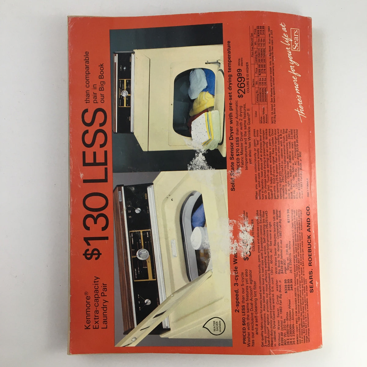 Sears Fall and Winter Atari 5200 Colecovision Price Guide Catalog showcasing a vintage advertisement for a Kenmore laundry pair, highlighting a $130 discount, with a focus on home appliances. Ideal for collectors of retro gaming and vintage magazines.