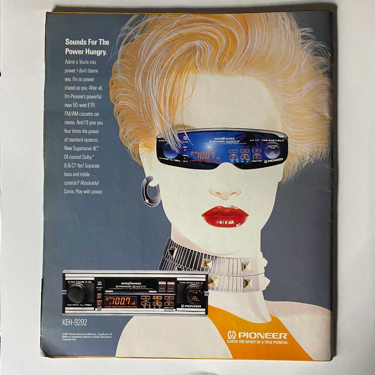 VTG Spin Magazine April 1987 Vol 3 No. 1 featuring an advertisement for Pioneer audio equipment with a stylish illustration of a woman with blonde hair and sunglasses, promoting 'Sounds For The Power Hungry' with a cassette stereo display.