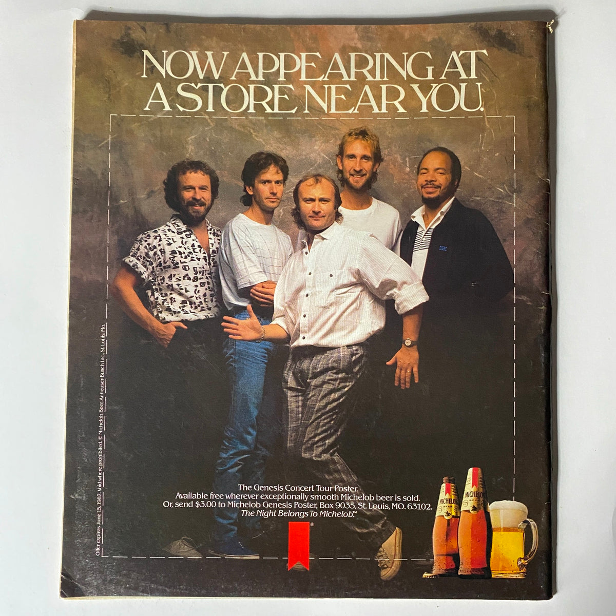 Back cover of VTG Spin Magazine May 1987 Vol 3 No. 2, advertising the Genesis Concert poster with a professional photo of the band members.