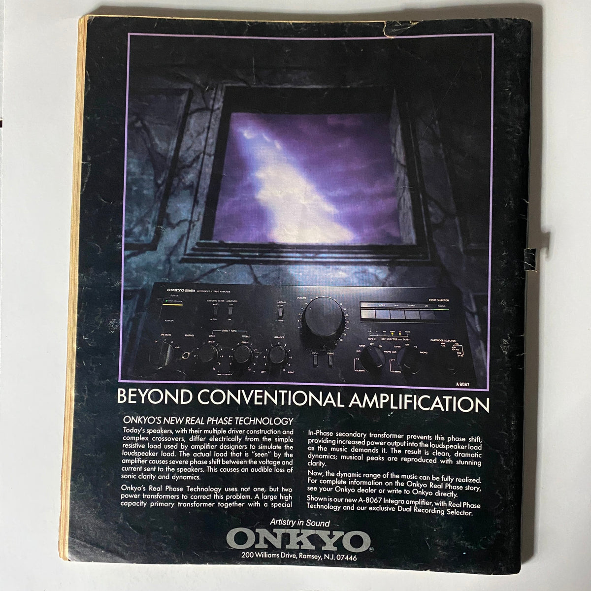Back cover of VTG Spin Magazine October 1985 Vol 1 No. 6 featuring a graphic design promoting Onkyo's Real Phase Technology with a description emphasizing its sound amplification features.