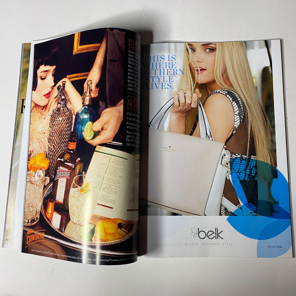 An advertisement spread from Vogue Magazine July 2013 displaying a glamorous pub scene with cocktails and a stylish woman holding a handbag, showcasing modern southern style.