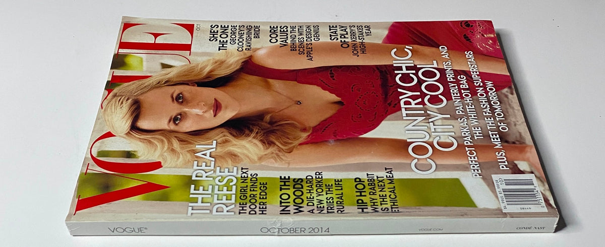 Side view of Vogue Magazine October 2014 with Reese Witherspoon on the cover. The magazine emphasizes 'Country Chic, City Cool' and includes features about modern fashion and influential women.