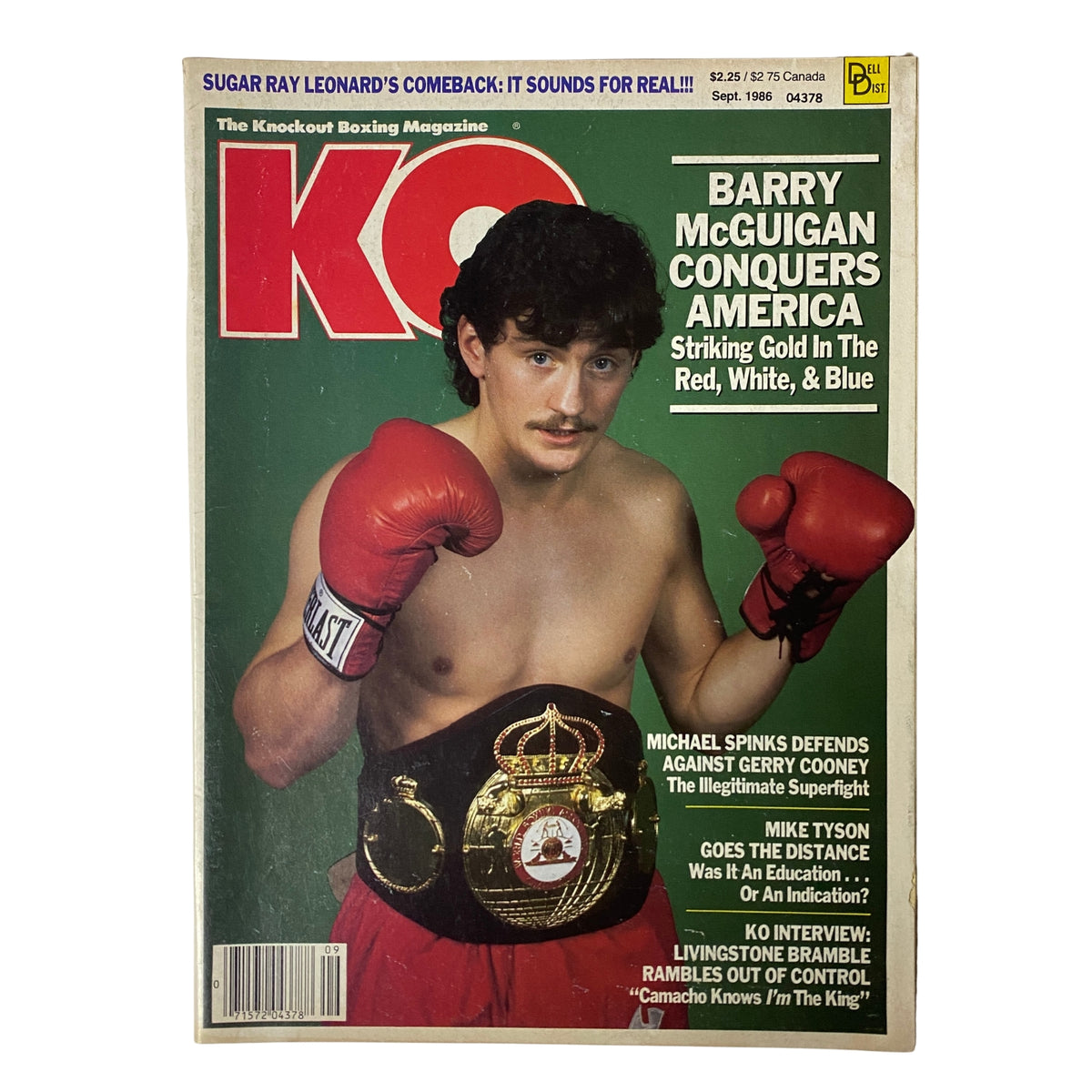 KO Boxing Magazine September 1986 featuring Barry McGuigan on the cover, showcasing his boxing success and vibrant graphic design with text highlighting his achievements.